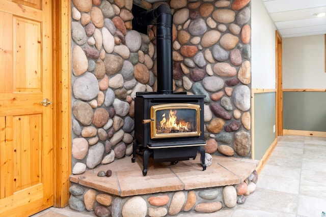 318 Marshall St, Duluth, MN 55803 - detailed view of a wood stove and baseboards