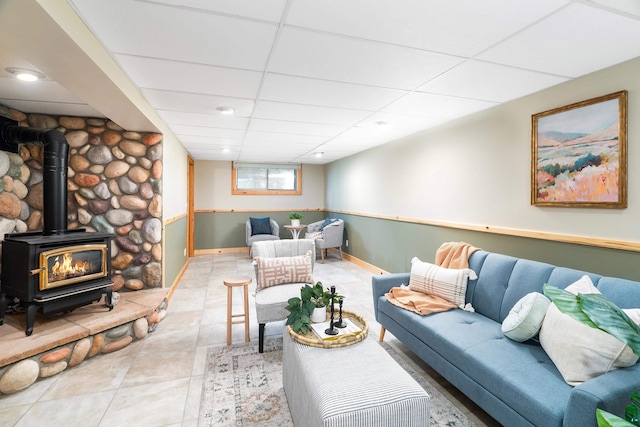 318 Marshall St, Duluth, MN 55803 - tiled living area with a wood stove and a drop ceiling