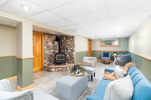 318 Marshall St, Duluth, MN 55803 - living area with a wood stove, a drop ceiling, light tile patterned flooring, and recessed lighting