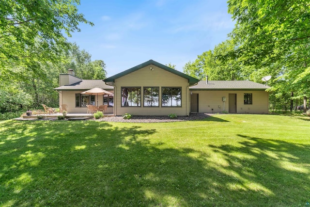 4930 Mini Power Rd, Duluth, MN 55803 - rear view of property with a chimney, a lawn, and a patio area