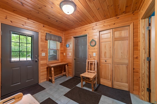 4930 Mini Power Rd, Duluth, MN 55803 - foyer with dark tile patterned flooring, wooden walls, and wood ceiling