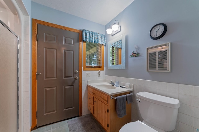 4930 Mini Power Rd, Duluth, MN 55803 - full bath featuring vanity, tile walls, tile patterned floors, and a wainscoted wall