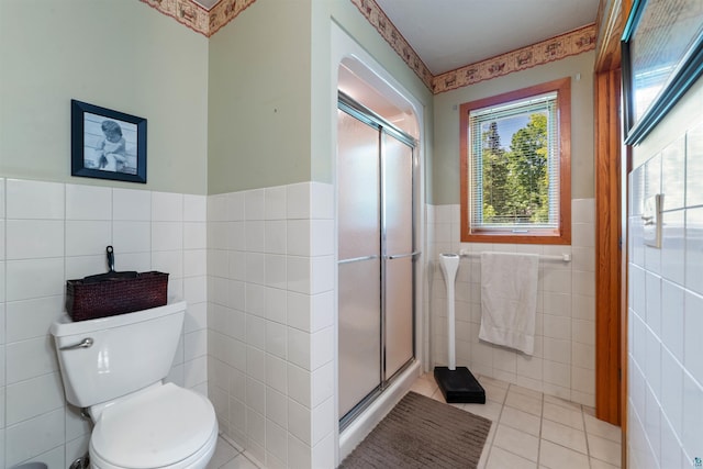 4930 Mini Power Rd, Duluth, MN 55803 - full bathroom featuring tile walls, a shower stall, wainscoting, and tile patterned flooring