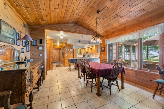 4930 Mini Power Rd, Duluth, MN 55803 - dining space featuring wood walls, light tile patterned flooring, vaulted ceiling, a chandelier, and wood ceiling