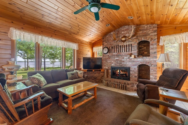4930 Mini Power Rd, Duluth, MN 55803 - living room with lofted ceiling, wood walls, a ceiling fan, a brick fireplace, and wood ceiling
