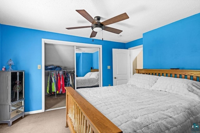 1025 W 3rd St, Duluth, MN 55806 - bedroom featuring carpet flooring, a closet, ceiling fan, and a textured ceiling