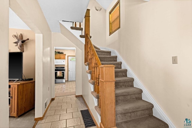 1025 W 3rd St, Duluth, MN 55806 - stairway featuring baseboards and stone finish flooring