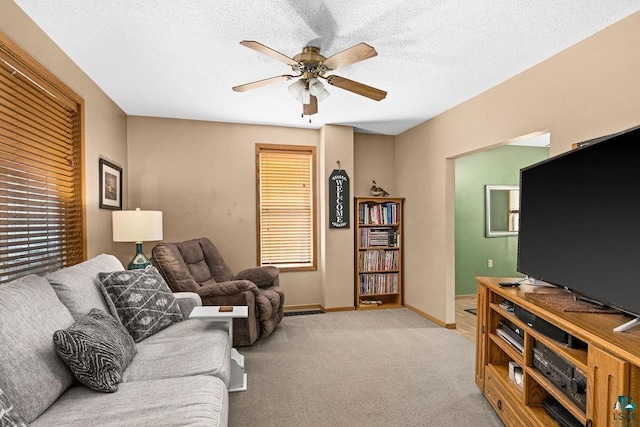 1025 W 3rd St, Duluth, MN 55806 - living area with a ceiling fan, light carpet, and a textured ceiling