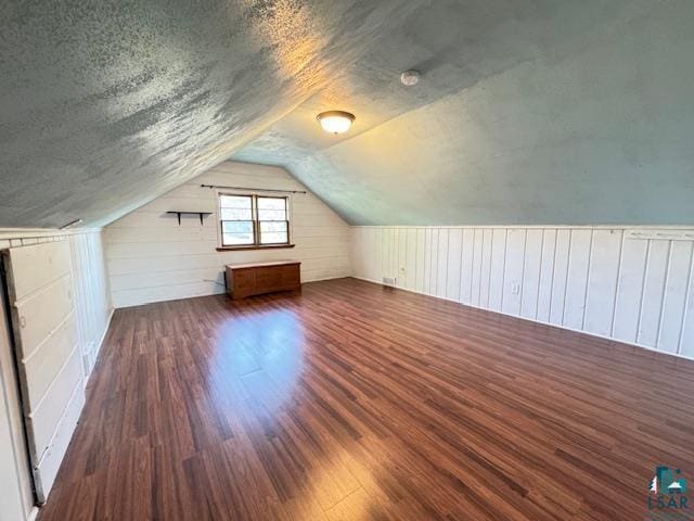 1339 92nd Ave W, Duluth, MN 55808 - bonus room featuring wood finished floors, lofted ceiling, a textured ceiling, and wood walls