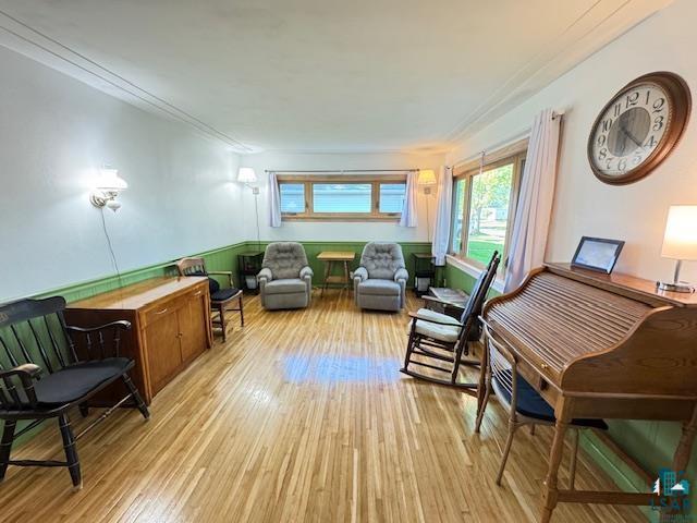 1339 92nd Ave W, Duluth, MN 55808 - living area featuring light wood finished floors and ornamental molding
