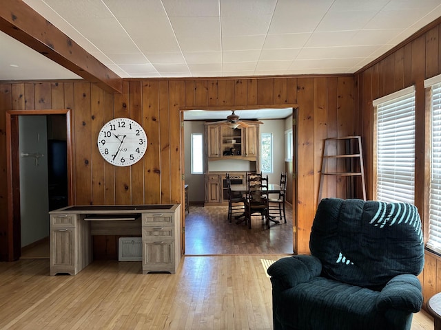 9235 Meadow St, Duluth, MN 55810 - living area featuring wood walls, light wood-style floors, and a ceiling fan
