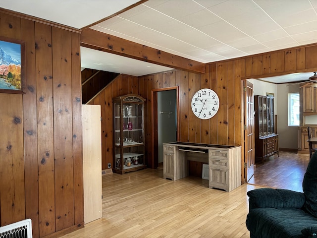 9235 Meadow St, Duluth, MN 55810 - kitchen featuring wood walls, light wood finished floors, beam ceiling, and open floor plan