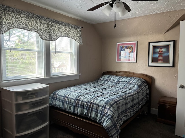 9235 Meadow St, Duluth, MN 55810 - bedroom with lofted ceiling, carpet flooring, a textured wall, and ceiling fan