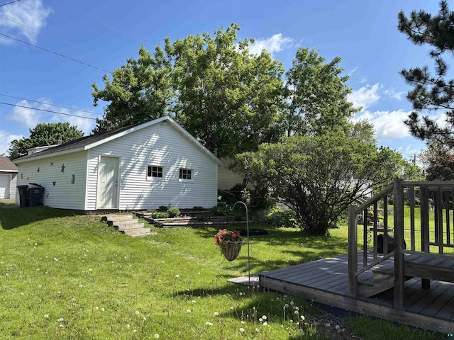 9235 Meadow St, Duluth, MN 55810 - view of grassy yard featuring a deck and an outdoor structure