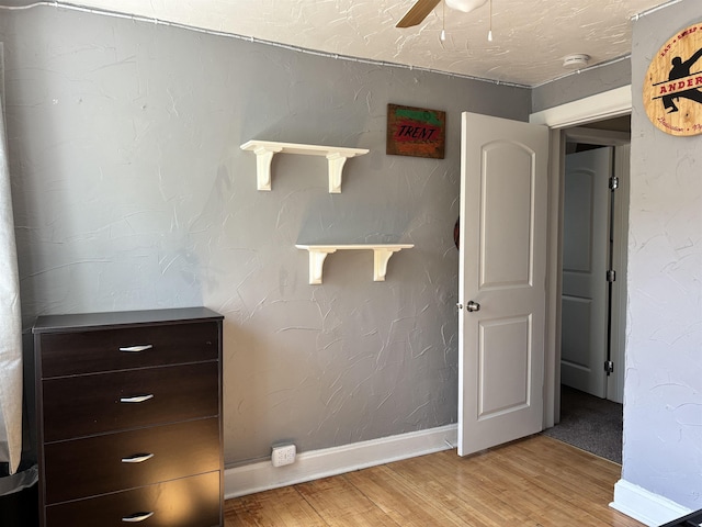 9235 Meadow St, Duluth, MN 55810 - detailed view of wood finished floors, a smoke detector, and a ceiling fan