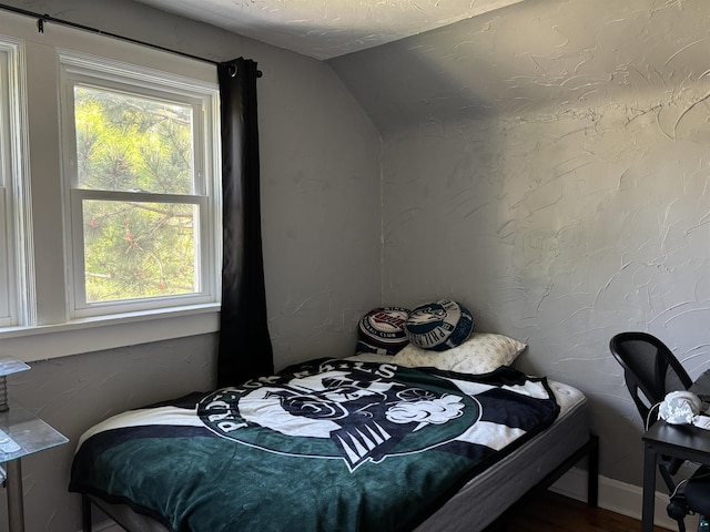 9235 Meadow St, Duluth, MN 55810 - bedroom with vaulted ceiling and wood finished floors