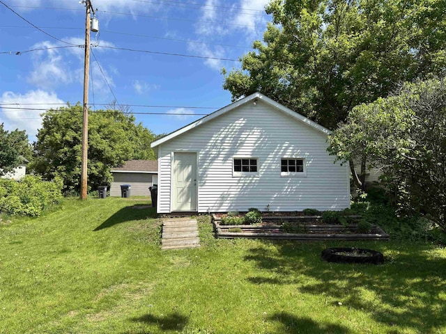 9235 Meadow St, Duluth, MN 55810 - back of house featuring a lawn