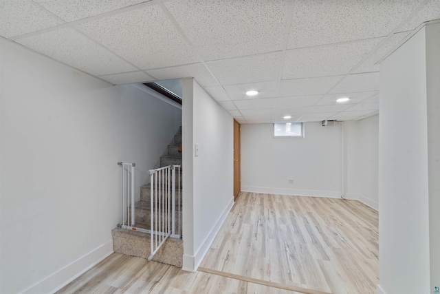 2420 Piedmont Ave, Duluth, MN 55811 - below grade area featuring stairs, wood finished floors, a drop ceiling, and recessed lighting