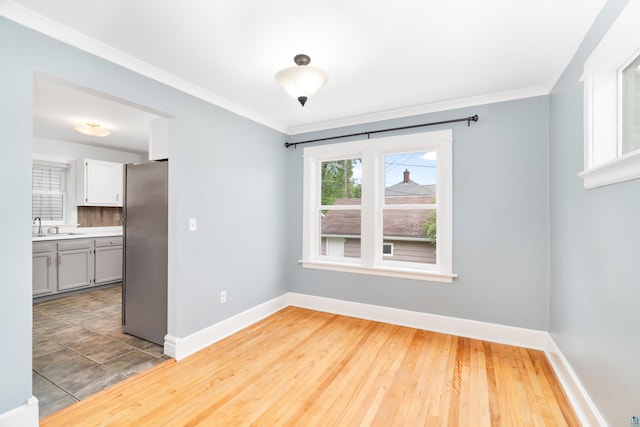 41 Cato Ave, Duluth, MN 55808 - spare room featuring ornamental molding and wood-type flooring