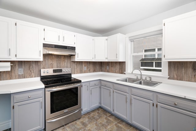 41 Cato Ave, Duluth, MN 55808 - kitchen with under cabinet range hood, stainless steel range with electric cooktop, gray cabinetry, tile patterned flooring, and light countertops