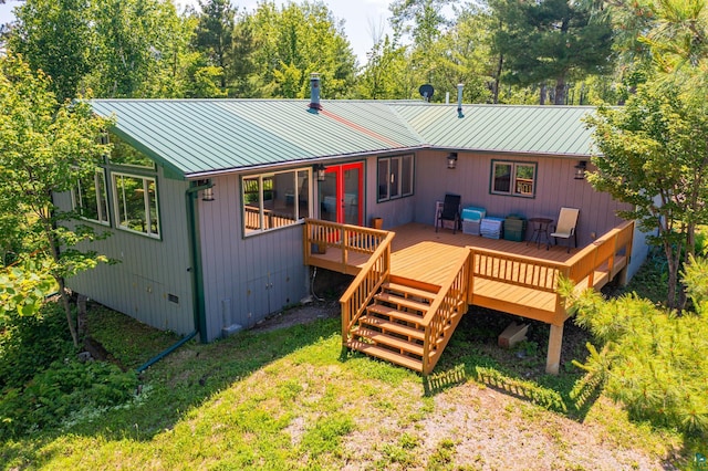 1475 Echo Trl, Ely, MN 55731 - rear view of property with a wooden deck, a metal roof, a standing seam roof, and an outdoor living space