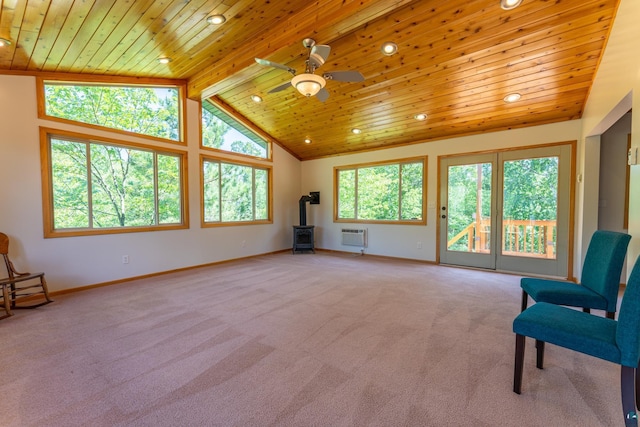 1475 Echo Trl, Ely, MN 55731 - unfurnished room featuring wooden ceiling, a wood stove, light carpet, ceiling fan, and recessed lighting