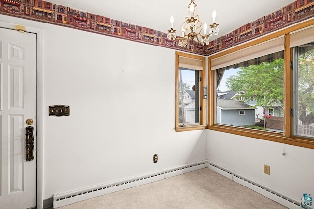 5525 Highland St, Duluth, MN 55807 - carpeted spare room featuring a chandelier, a baseboard heating unit, and plenty of natural light