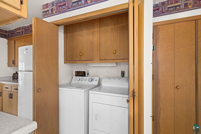 5525 Highland St, Duluth, MN 55807 - laundry room with washing machine and dryer and cabinet space