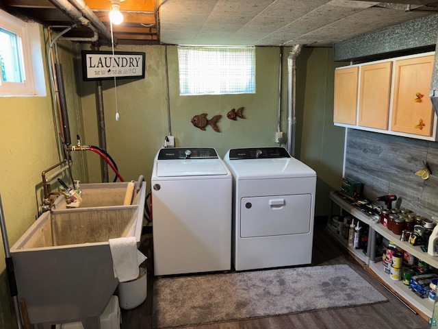 1264 92nd Ave W, Duluth, MN 55808 - laundry room with washer and clothes dryer, plenty of natural light, cabinet space, and wood finished floors