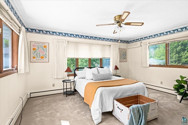 2807 E 2nd St, Duluth, MN 55812 - carpeted bedroom with baseboard heating, multiple windows, and a wall mounted AC