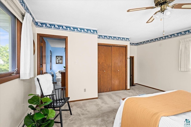 2807 E 2nd St, Duluth, MN 55812 - bedroom with light colored carpet, a closet, and a ceiling fan