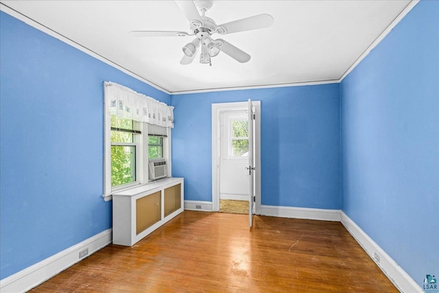 2807 E 2nd St, Duluth, MN 55812 - unfurnished room with ornamental molding, wood finished floors, cooling unit, and ceiling fan