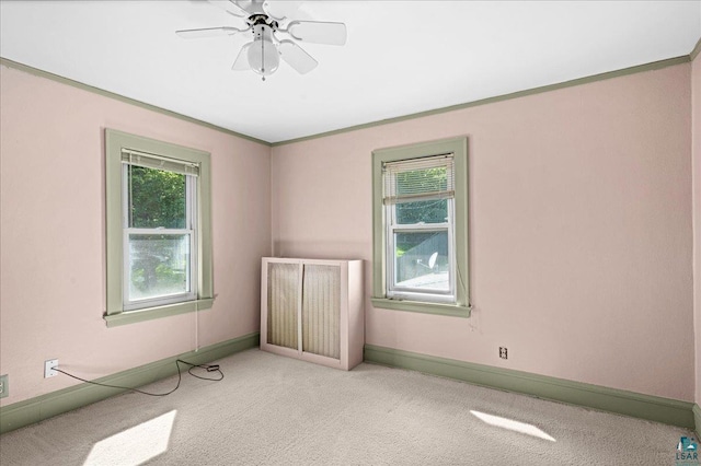 2807 E 2nd St, Duluth, MN 55812 - spare room featuring carpet floors, ceiling fan, and ornamental molding