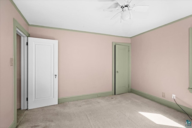 2807 E 2nd St, Duluth, MN 55812 - empty room featuring carpet, ceiling fan, and crown molding