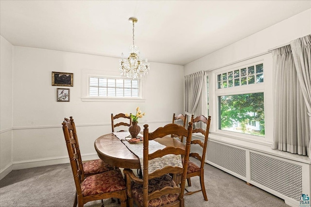 2807 E 2nd St, Duluth, MN 55812 - dining area featuring radiator heating unit, light carpet, and a chandelier