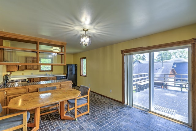 4128 Gladstone St, Duluth, MN 55804 - dining space featuring baseboards and a chandelier