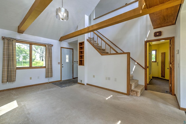 4128 Gladstone St, Duluth, MN 55804 - carpeted foyer entrance with stairway, a chandelier, and high vaulted ceiling