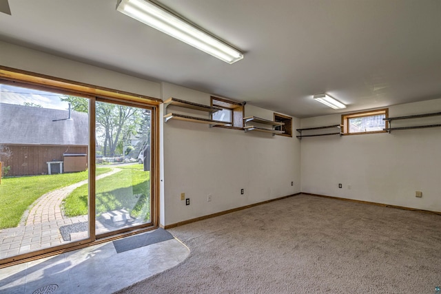 4128 Gladstone St, Duluth, MN 55804 - doorway to outside featuring light carpet and baseboards