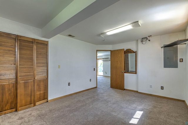 4128 Gladstone St, Duluth, MN 55804 - unfurnished bedroom with electric panel, light colored carpet, and a closet