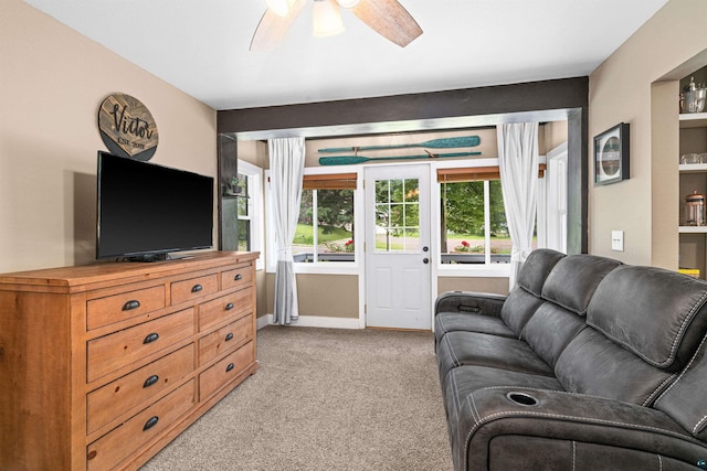 136 W Winona St, Duluth, MN 55803 - living room featuring light colored carpet and a ceiling fan
