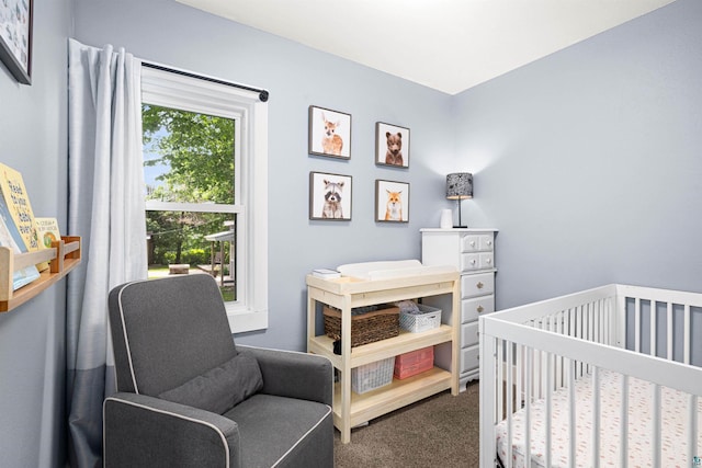 136 W Winona St, Duluth, MN 55803 - bedroom featuring dark colored carpet and a nursery area