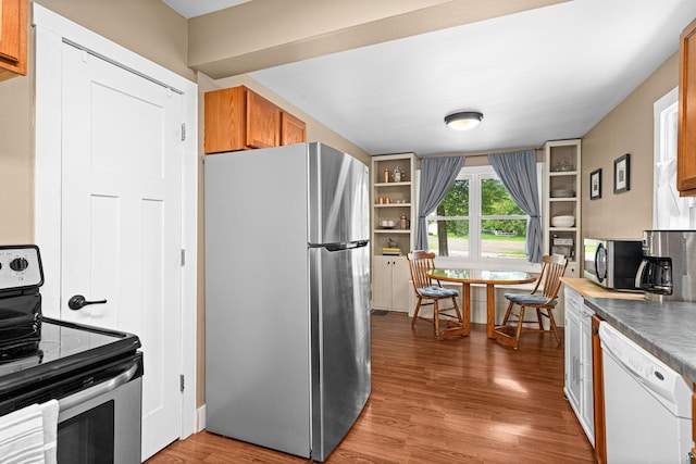 136 W Winona St, Duluth, MN 55803 - kitchen featuring appliances with stainless steel finishes, wood finished floors, and brown cabinetry