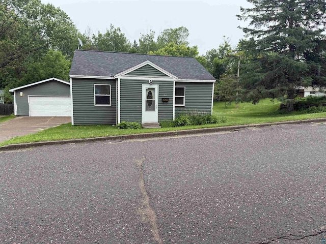 812 Allen St, Cloquet, MN 55720 - view of front of property featuring an outbuilding, a detached garage, and a shingled roof