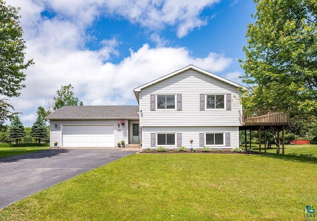 1207 Jean Marie St, Cloquet, MN 55720 - split level home with asphalt driveway, a garage, a front lawn, and a deck