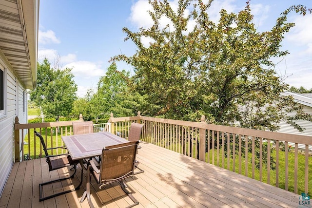 1207 Jean Marie St, Cloquet, MN 55720 - deck with outdoor dining space and a lawn