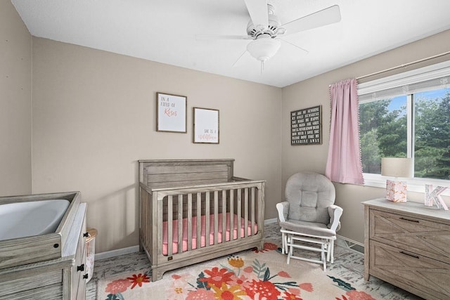 1207 Jean Marie St, Cloquet, MN 55720 - bedroom featuring ceiling fan and a nursery area