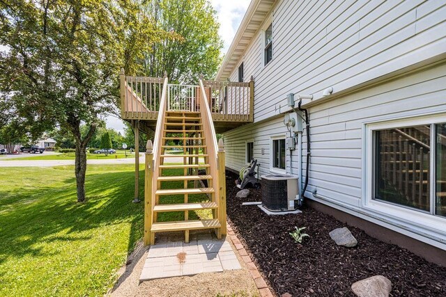 1207 Jean Marie St, Cloquet, MN 55720 - deck with stairs and a lawn