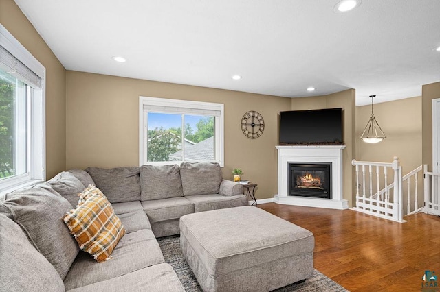 1207 Jean Marie St, Cloquet, MN 55720 - living area with plenty of natural light, wood finished floors, recessed lighting, and a glass covered fireplace