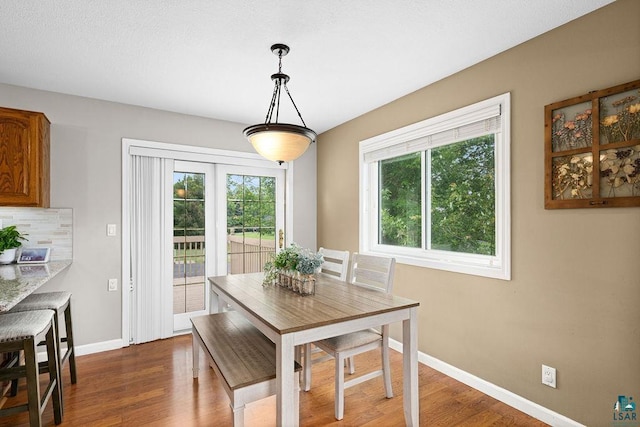 1207 Jean Marie St, Cloquet, MN 55720 - dining area featuring baseboards and dark wood-style flooring