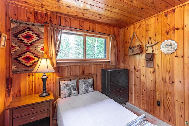 14575 Jackpine Trl, Ely, MN 55731 - bedroom featuring wood walls, wooden ceiling, and carpet flooring